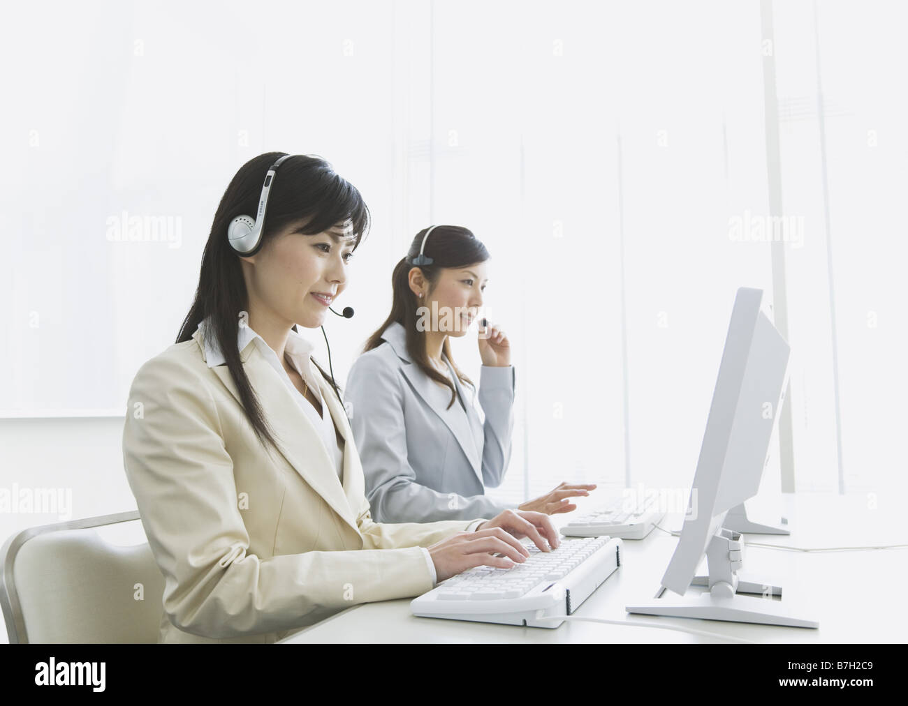 Operators working in the office Stock Photo - Alamy