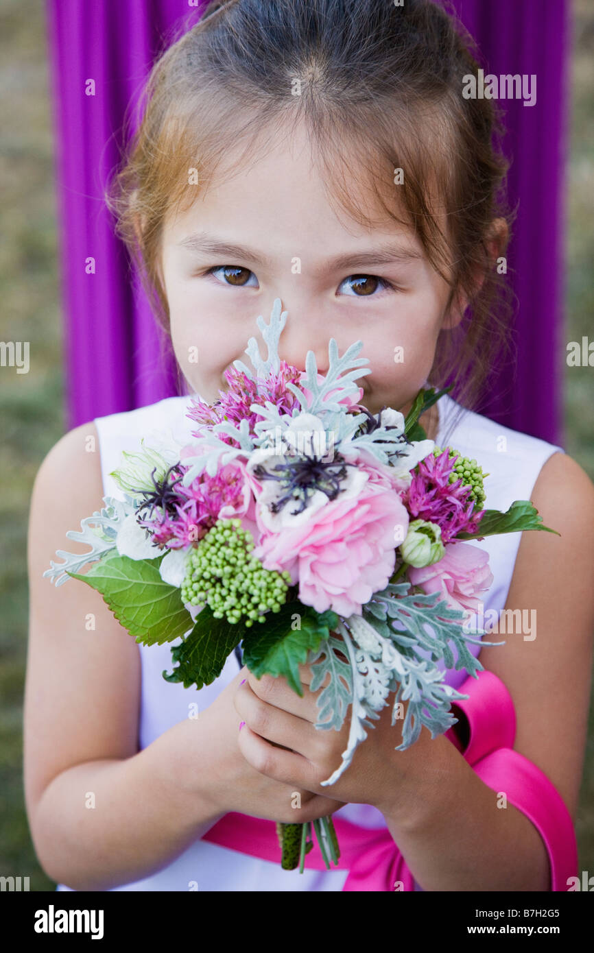 Asian flower girl holding floral bouquet Stock Photo Alamy