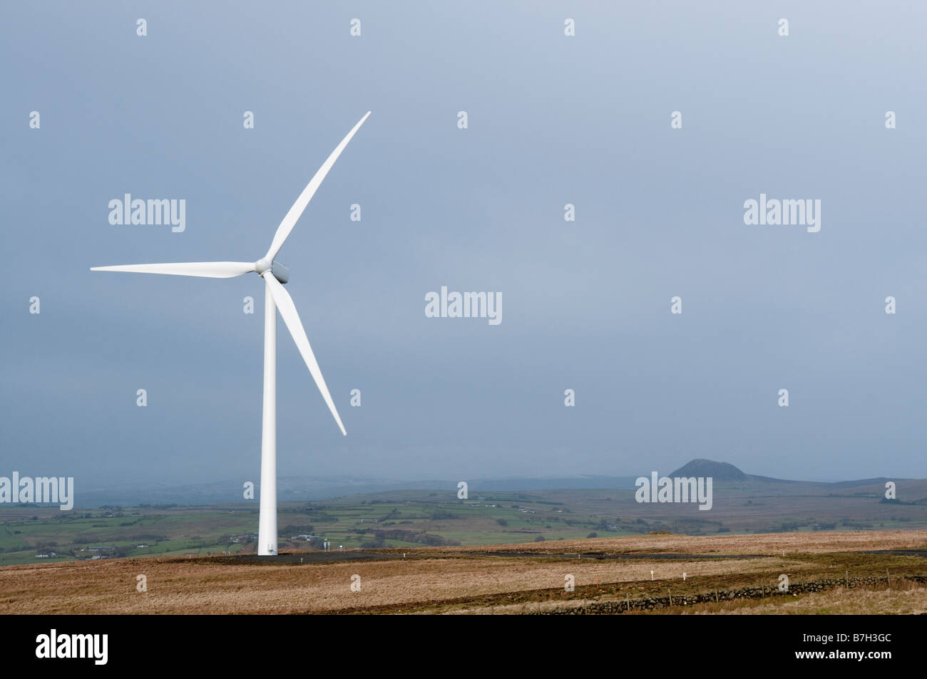 Wind turbine at Elliots Hill/Wolf Bog windfarm outside Ballyclare, County Antrim.  Slemish visible in background. Stock Photo