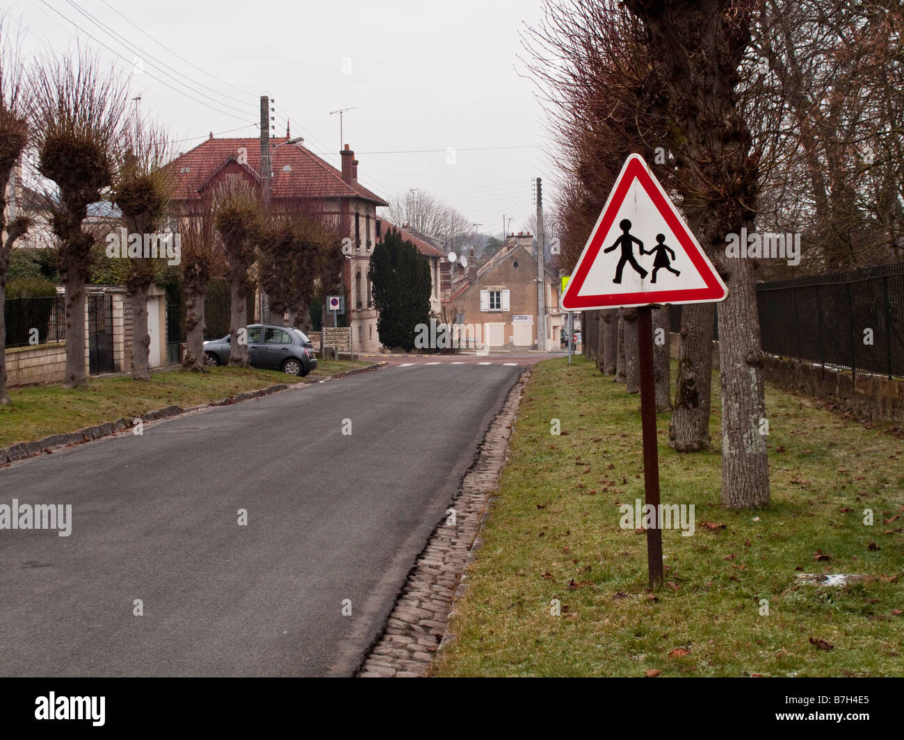 Children Crossing sign in the village of Precy sur Oise in France Jan 2009 Stock Photo