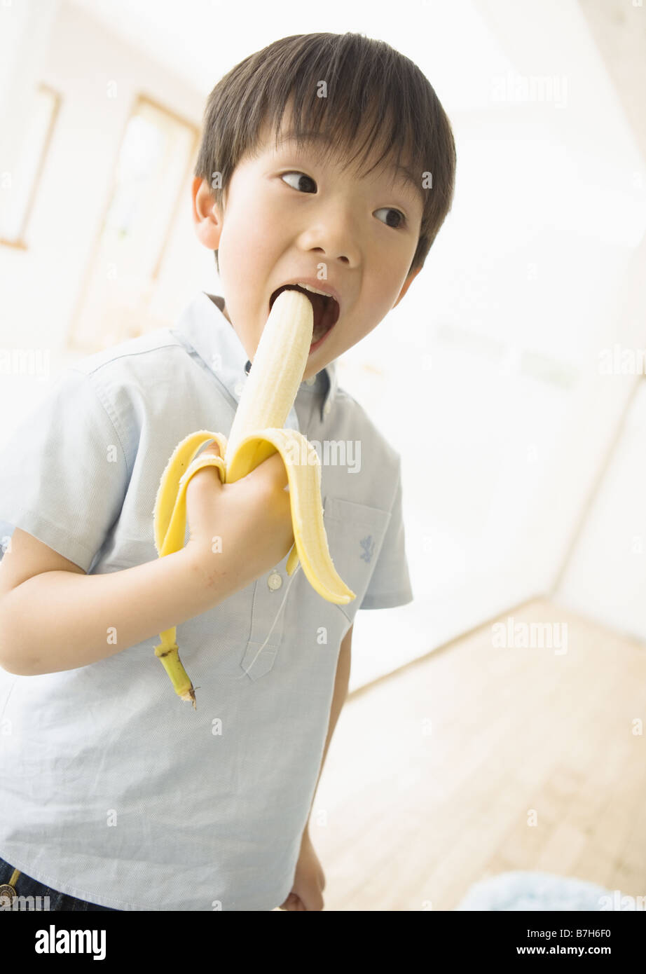 Boy Eating Banana Stock Photo Alamy