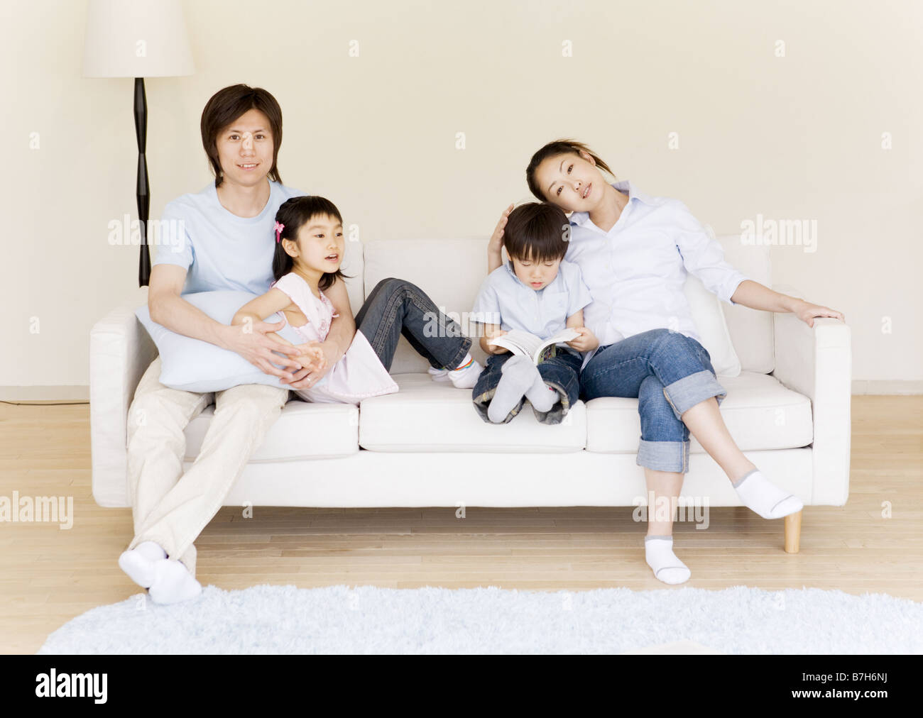 Happy Young Family Stock Photo - Alamy