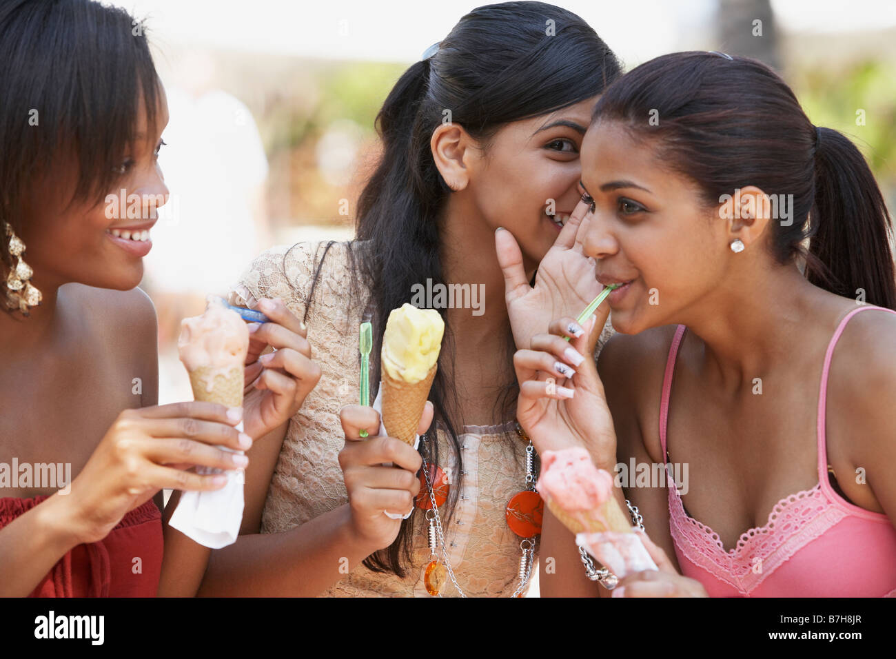 Teenage friends sharing secrets Stock Photo