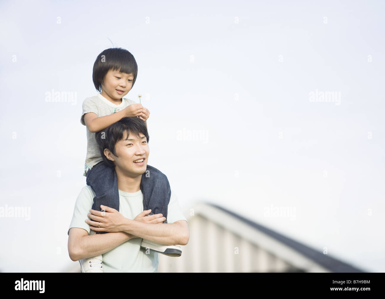 Father carrying son on his shoulders Stock Photo - Alamy