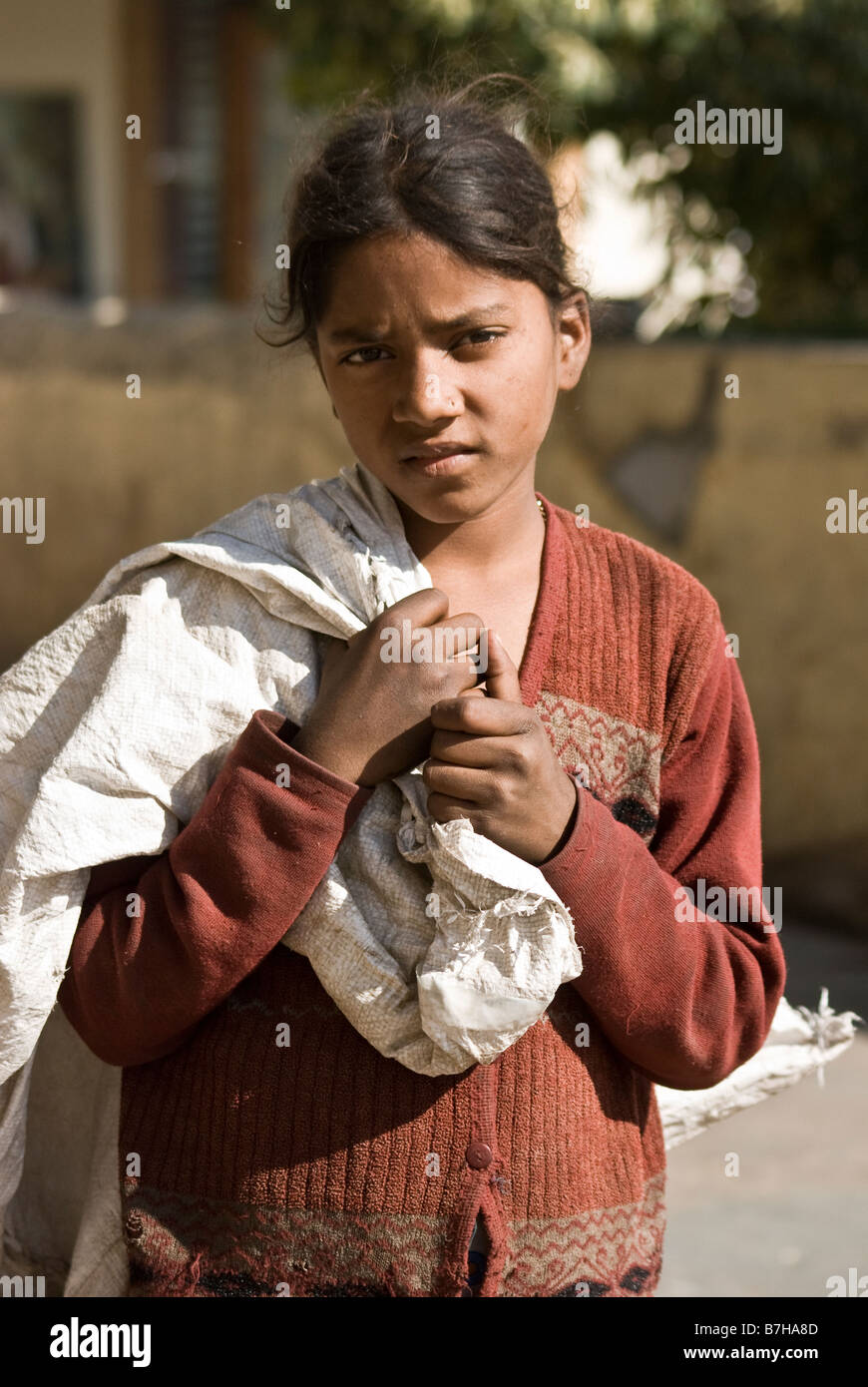 A child begging amongst the tourists within Rajasthans capital. Stock Photo