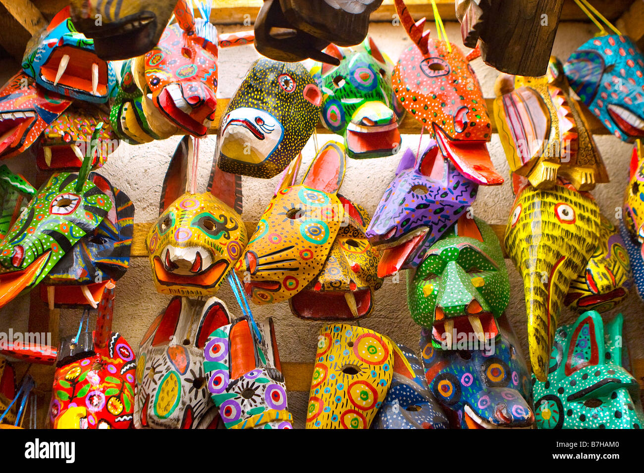 Close up of traditional Guatemalan masks and handicrafts at market in