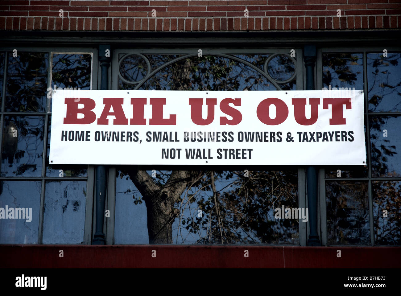 Bail Us Out sign on a building November 2008 Stock Photo