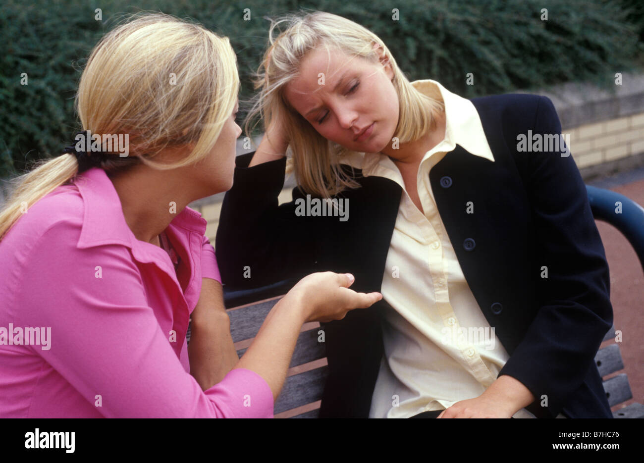 two young women talking seriously Stock Photo