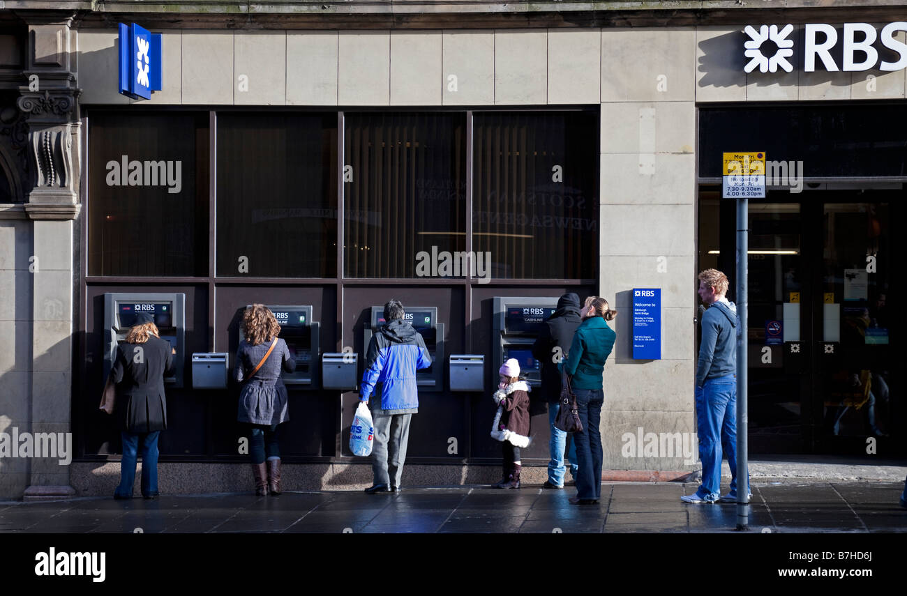 People queuing at Royal Bank of Scotland bank cash machines, Edinburgh, Scotland, UK, Europe Stock Photo