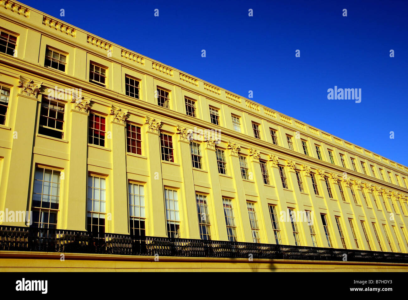 The regency architecture of Brunswick Terrace in Hove seen on a late, sunny afternoon Stock Photo