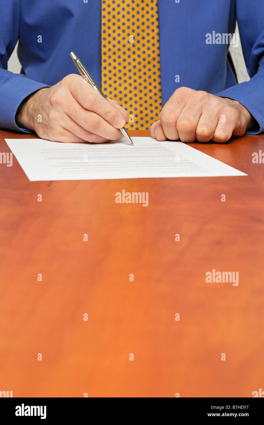 Businessman Signing a Contract Close Up Stock Photo