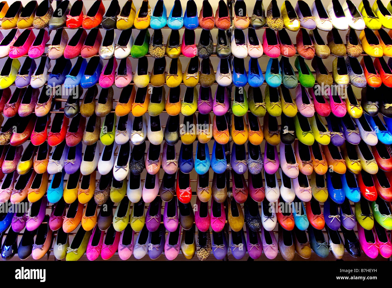 over 200 munticoloured ladies shoes on a shelf Stock Photo