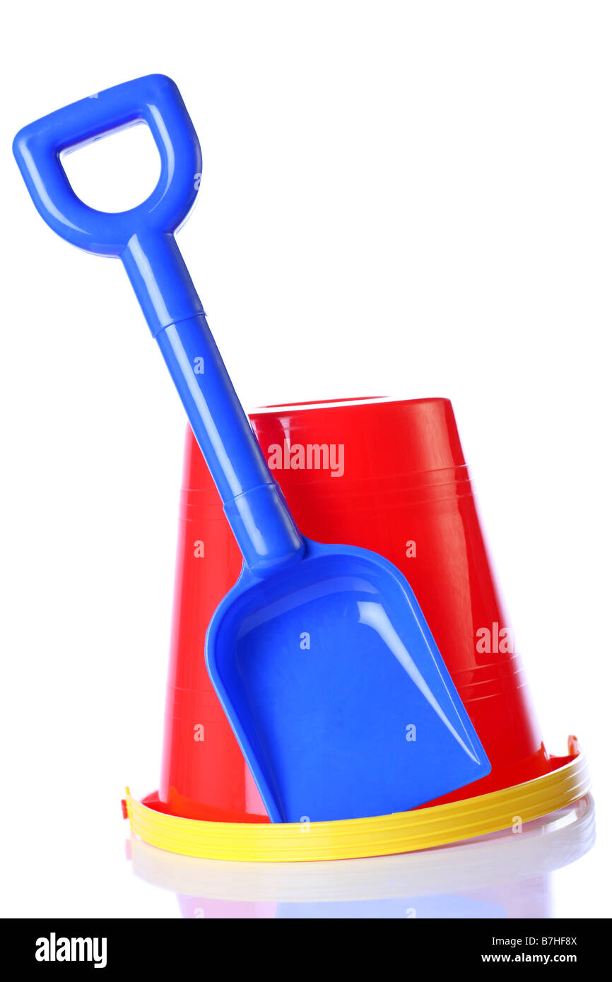 red bucket and blue spade ready for summer fun Stock Photo Alamy