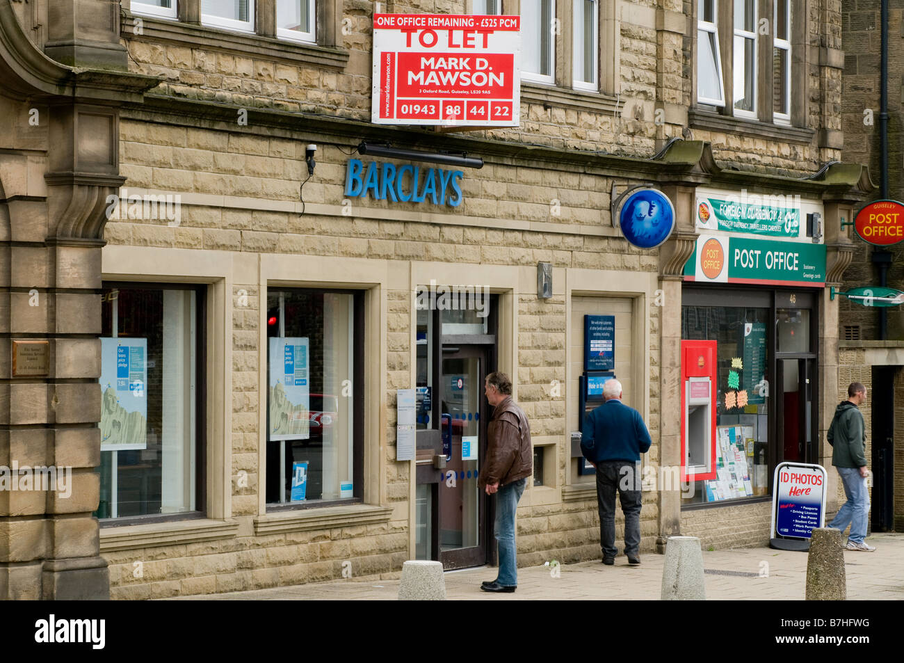 A high street branch of Barclays bank, with a Post Office alongside