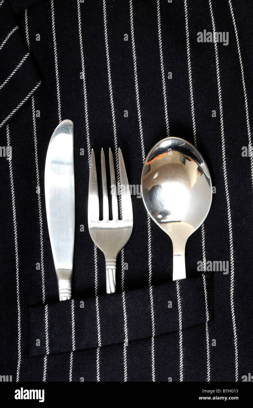 business suit with knife fork and spoon in pocket food eating out lunch dinner take away prepared wool jacket stripes ready Stock Photo