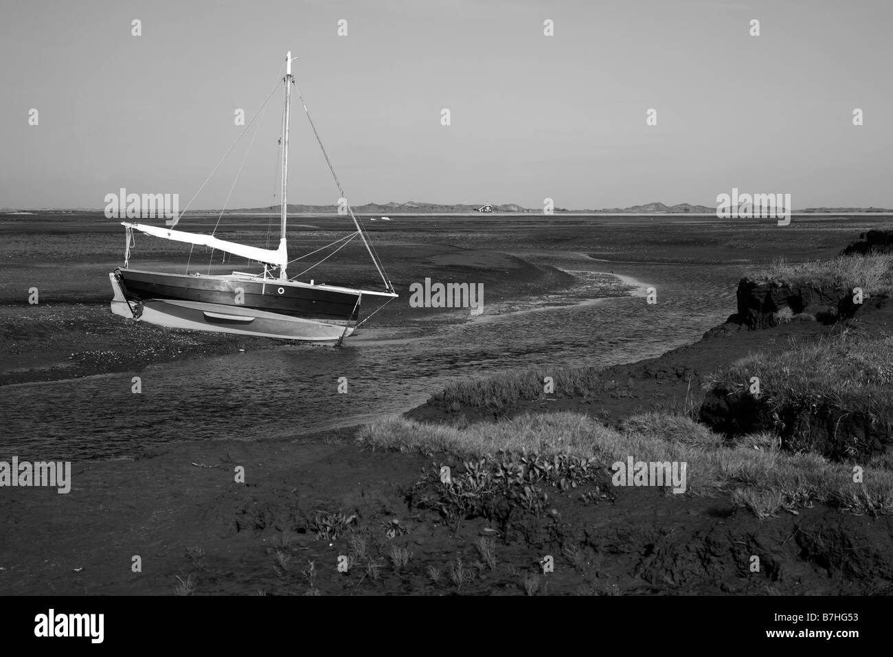 Lone beached boat Black and White Stock Photos & Images - Alamy