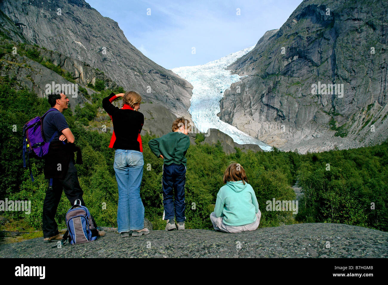 family admiring glacier in Norway Stock Photo