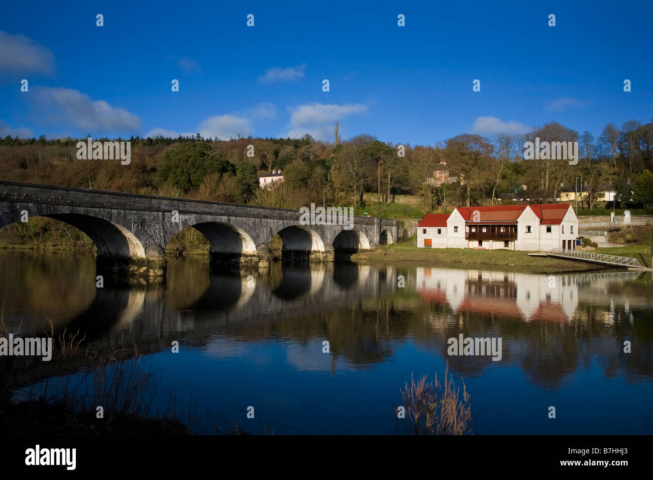 19th Century Avonmore Bridge over the Blackwater River, And Cappoquin Rowing Club Boathouse, Cappoquin, County Waterford, Ireland Stock Photo