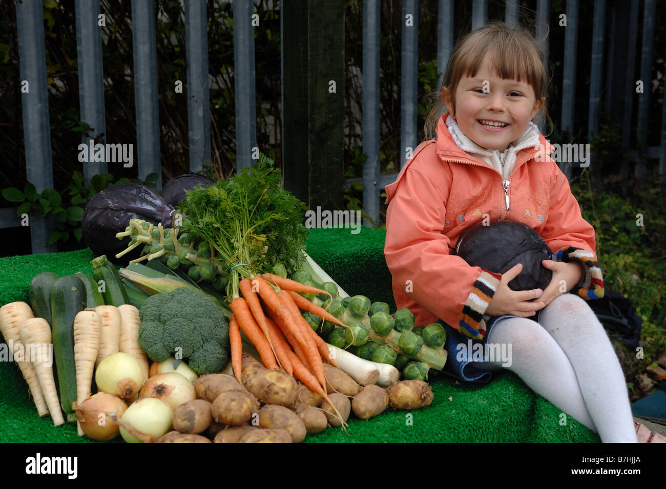 Child with a variety of garden vegetables Stock Photo