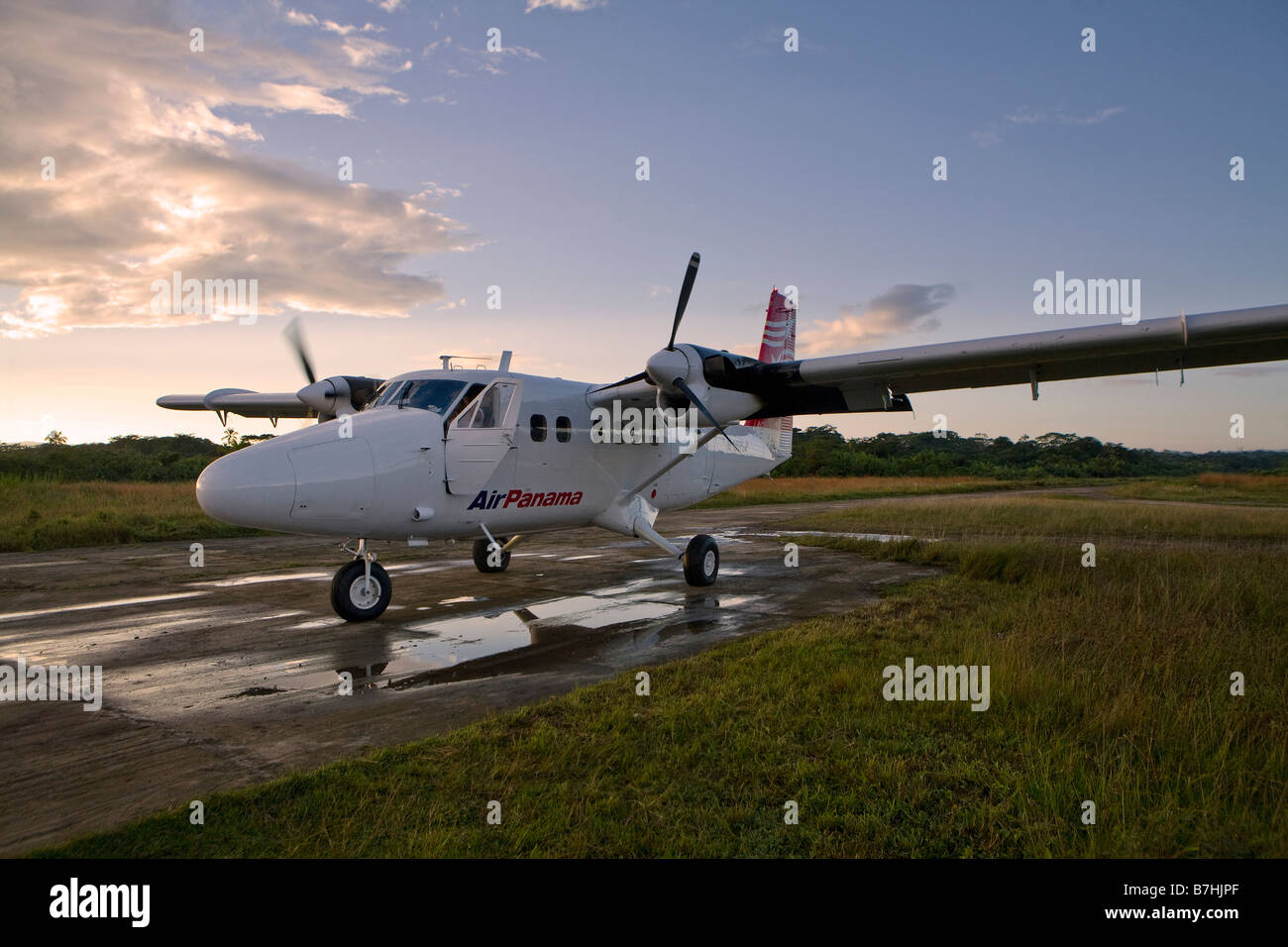 Air Panama plane sitting on the runway in Carti during sunrise San Blas Islands, Kuna Yala, Panama Stock Photo