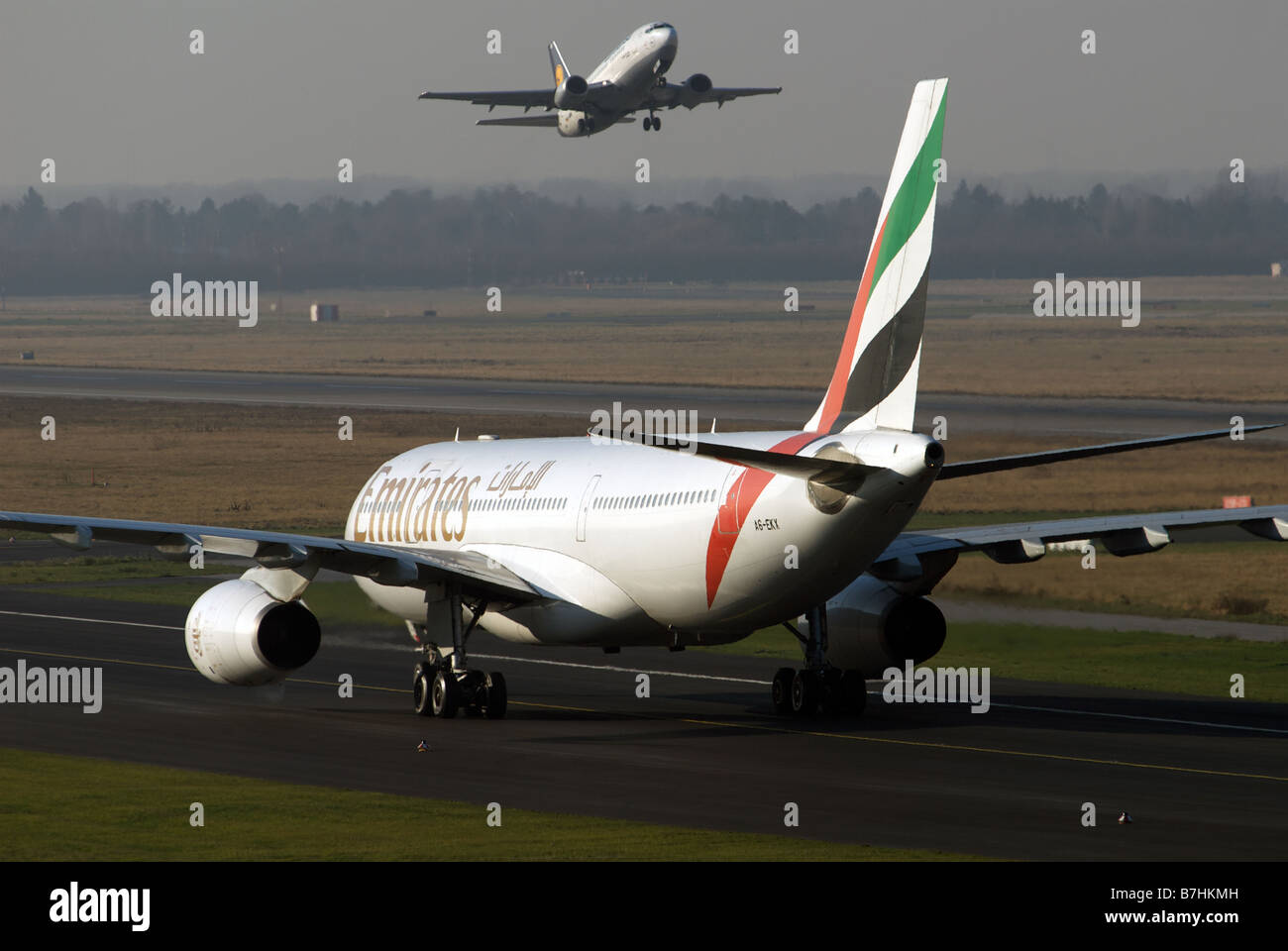 Emirates Airways Airbus A330-200 passenger airliner and Lufthansa Boeing 737, Dusseldorf International Airport, Germany. Stock Photo