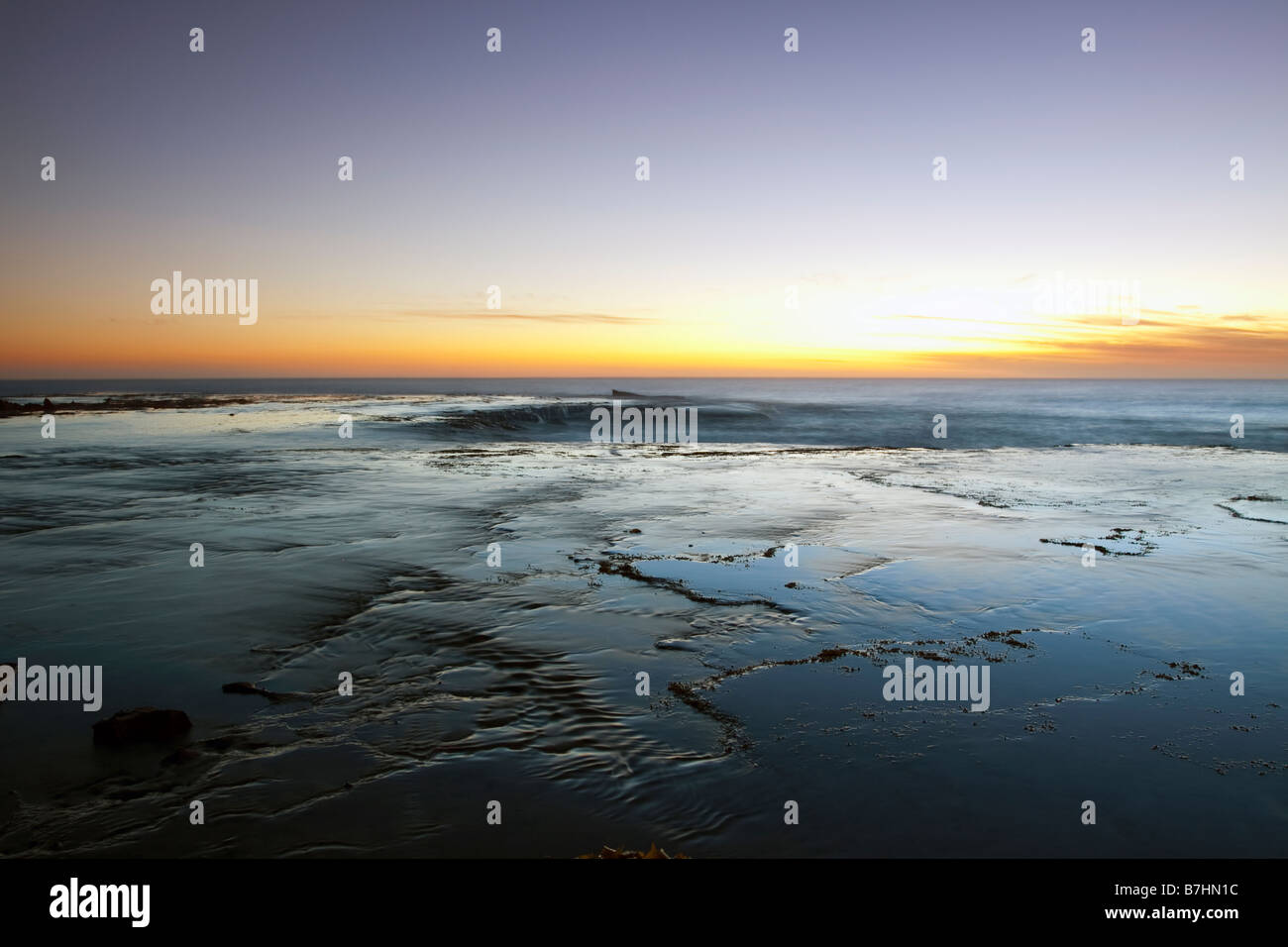Ocean waves and cliffs at sunrise hi-res stock photography and images ...