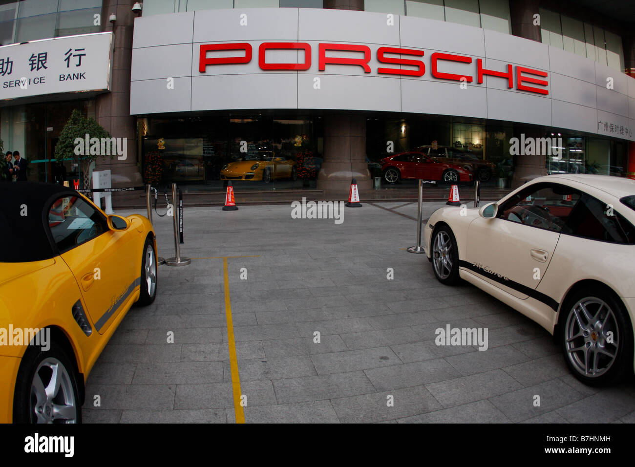 Porsche Dealership storefront with Chinese New Year Decorative Red Lanterns  and Chinese Characters on sign White 911 Carrera and Stock Photo - Alamy