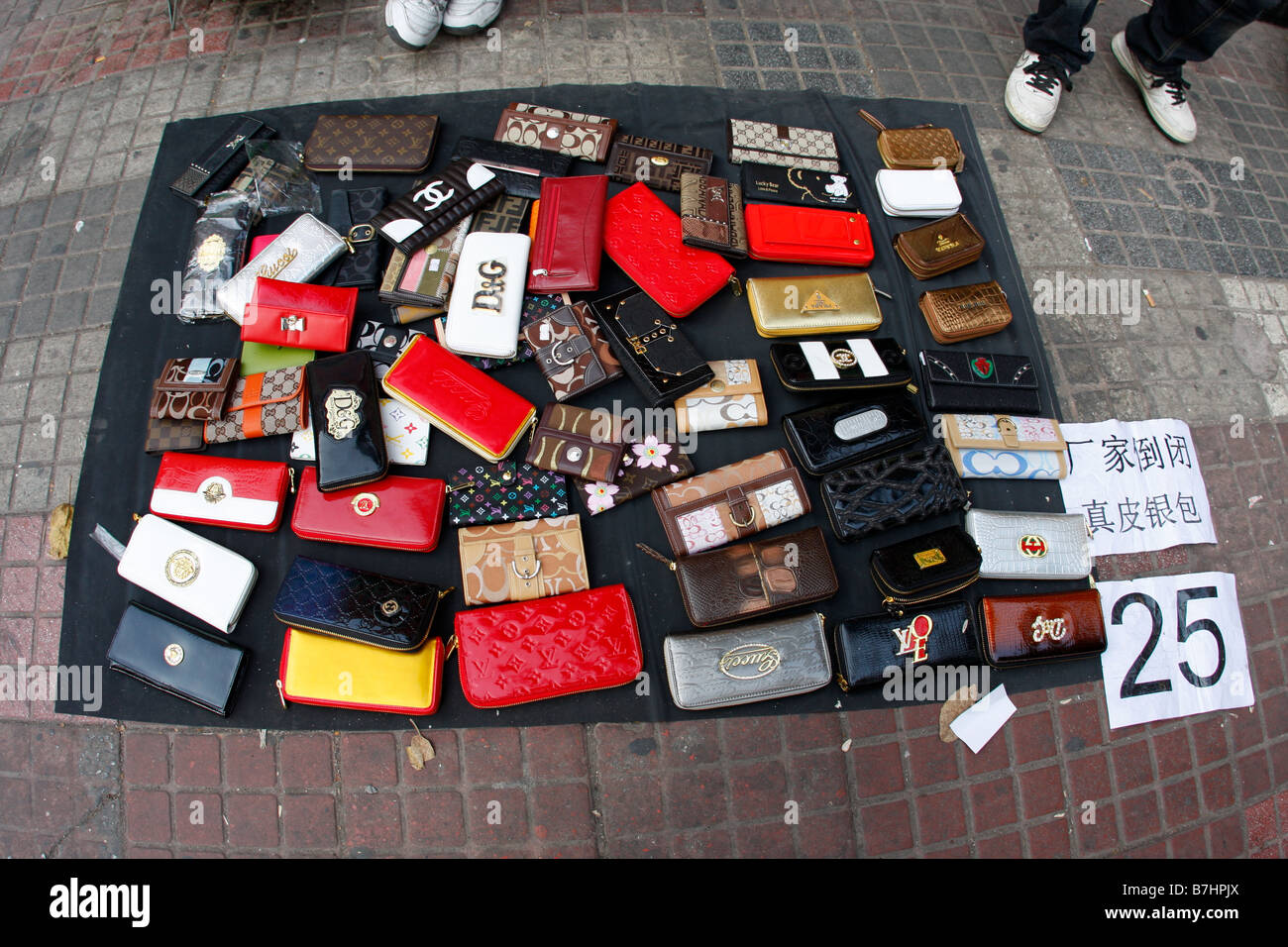 Fake luxury purses are sold on a sidewalk in downtown Guiyang, the capital  of China's Guizhou