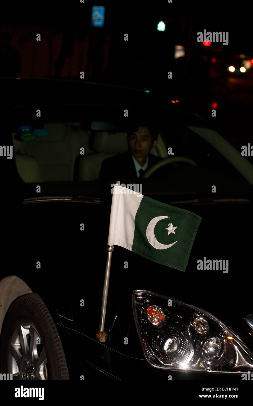 A Pakistani official car in Downtown Guangzhou China displaying Pakistani Flag Stock Photo