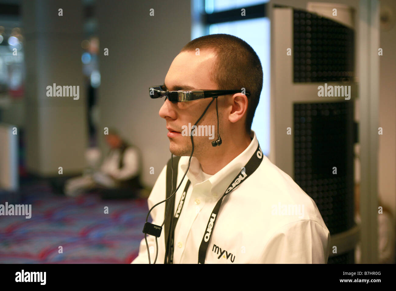 Jan 8, 2009 - Las Vegas, Nevada, USA - Specialist Jeremy Cui shows Myvu Crystal model personal media viewer at CES trade show. Stock Photo