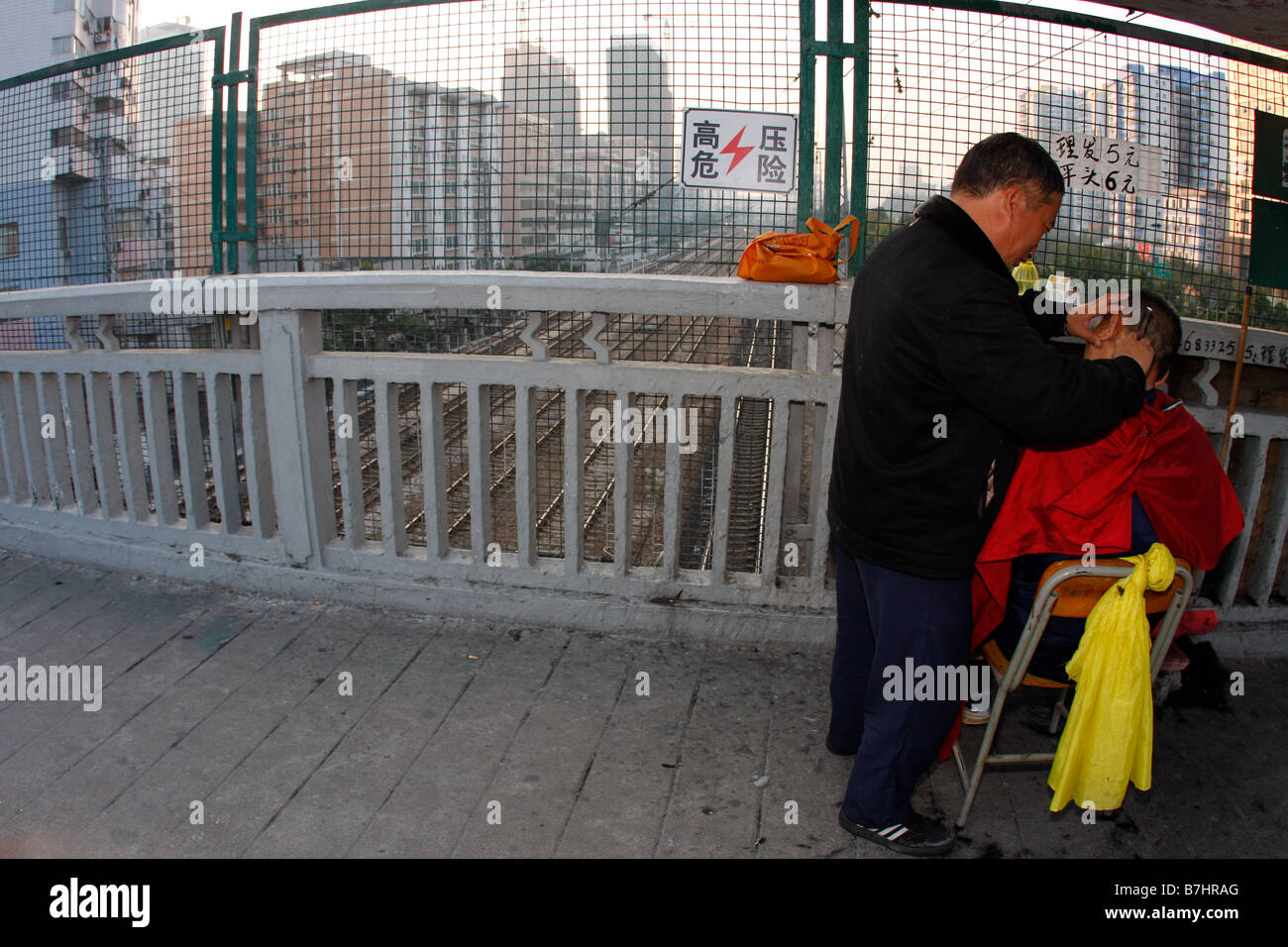 An unregulated self made street barber shop in Guangzhou China Stock Photo