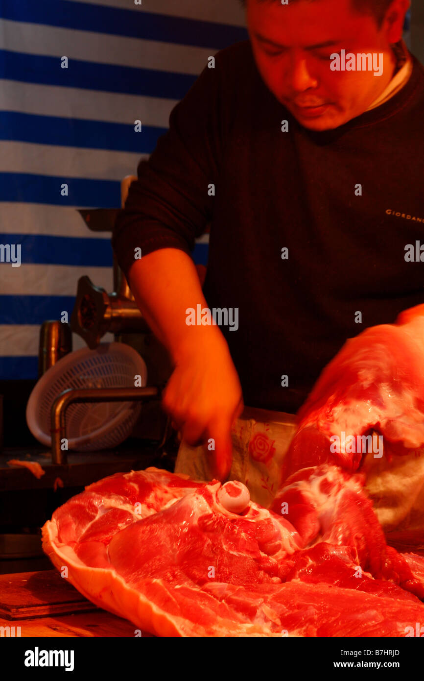 Chinese Butcher cutting meat in local market Stock Photo - Alamy
