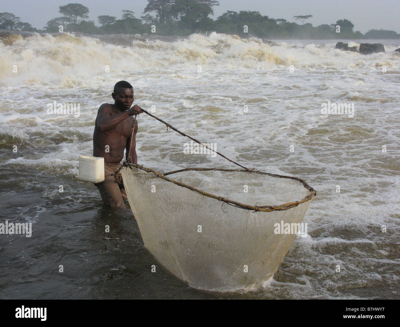 Wagenia fisherman using scoop net at Stanley Falls Chutes Boyoma on