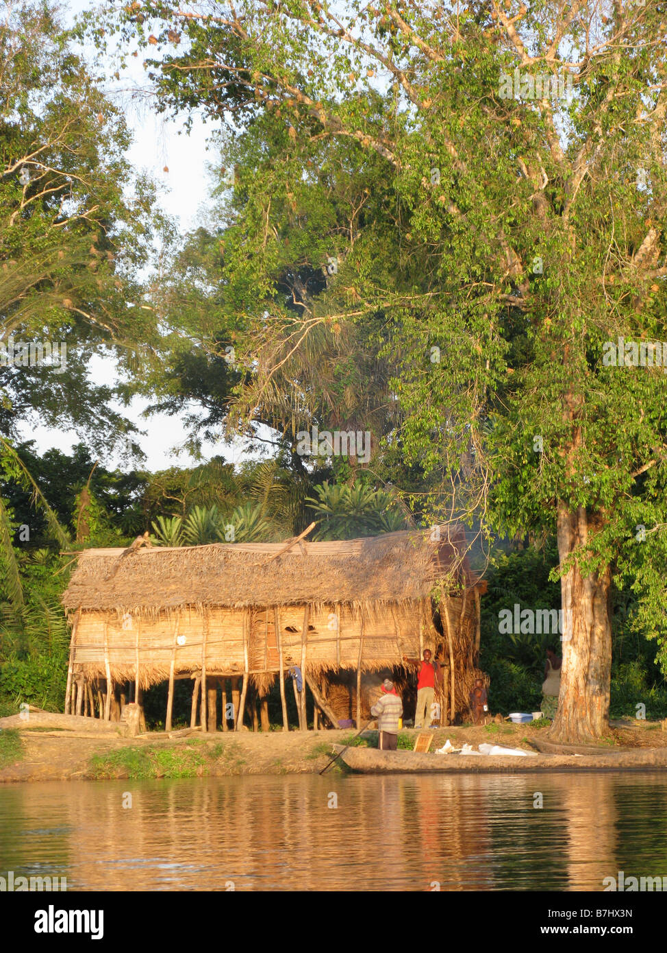 Fishing village thatched roofed huts of grass and reeds set on stilts