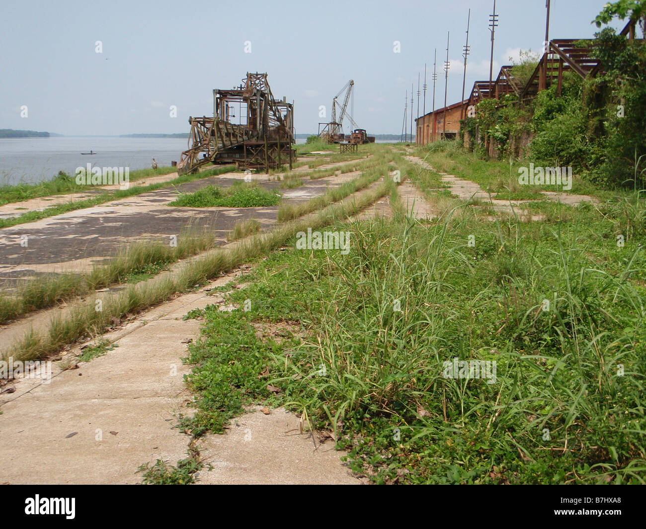Abandoned neglected dockside with broken cranes in Ubundu near Kisangi Democratic Republic of Congo Orientale Province Stock Photo