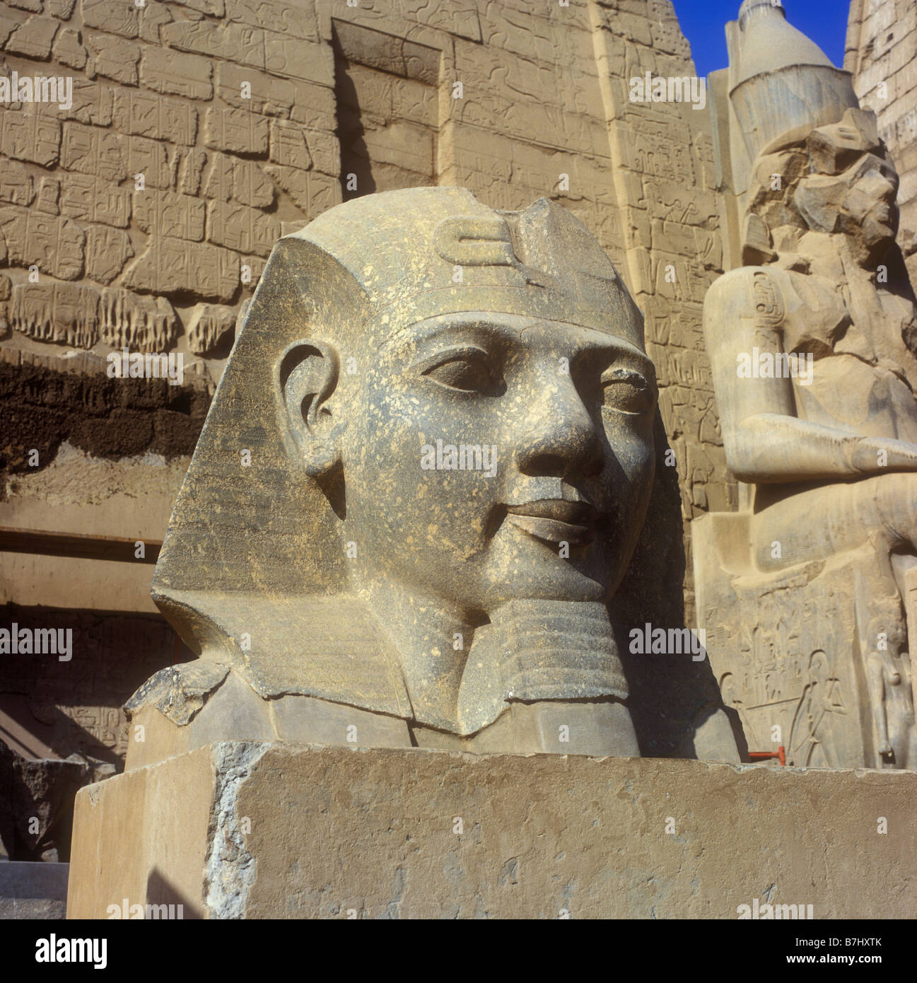 Carved head of Rameses II at the Temple of Luxor, a large ancient Egyptian temple complex on the east bank of the River Nile Stock Photo