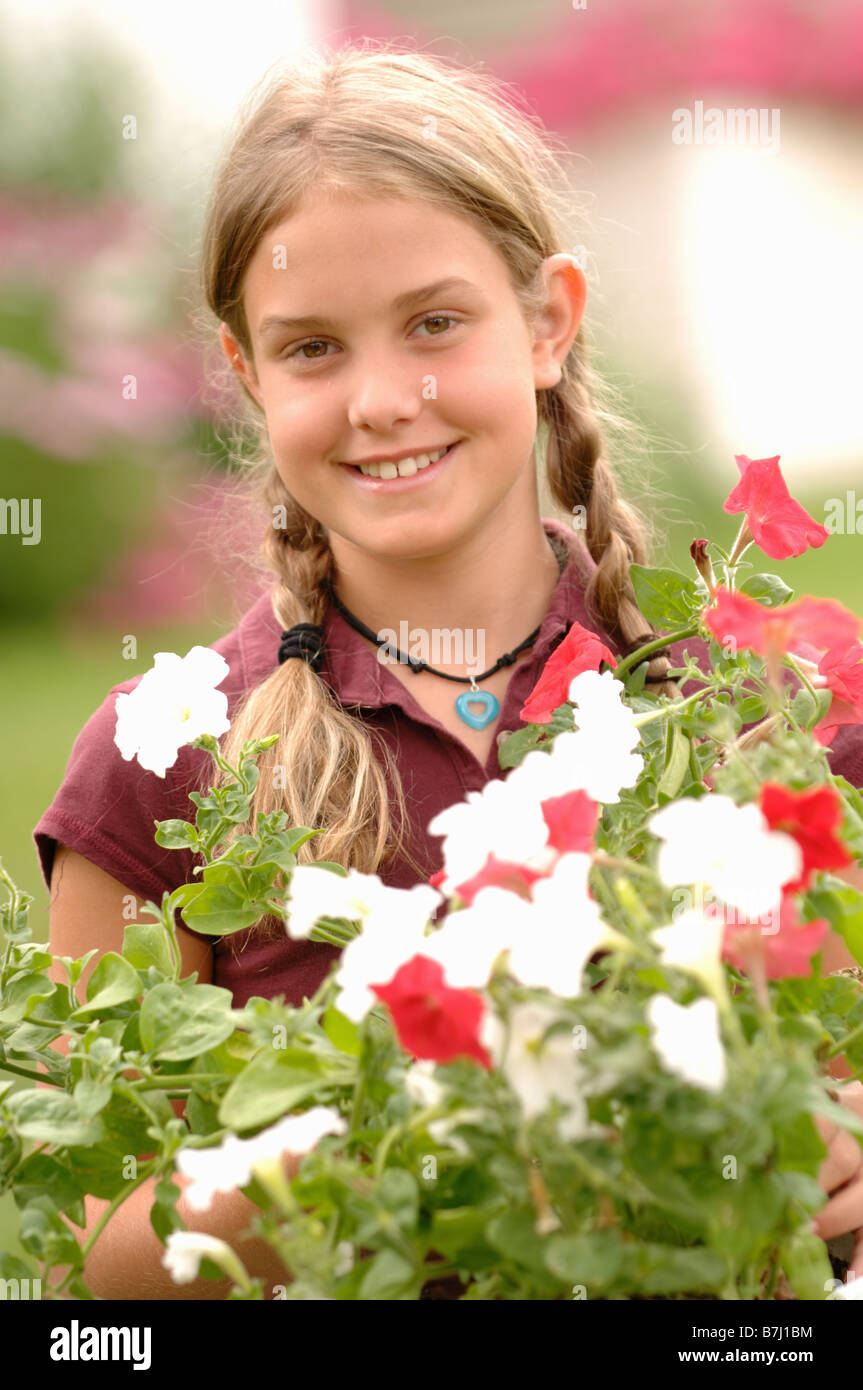 Young girl holding flowers, Regina, Saskatchewan Stock Photo Alamy