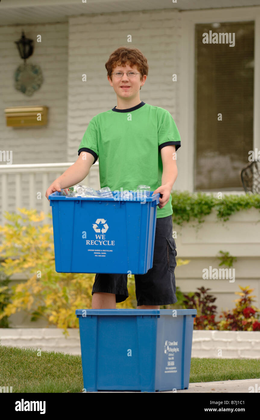 Boy taking recycling to curb, Regina, Saskatchewan Stock Photo Alamy