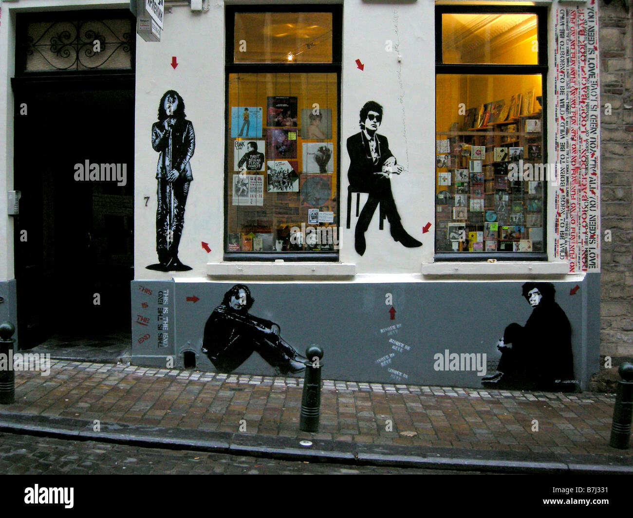 Graffiti artist Jeff Aerosol red arrow Jim Morrison, John Lennon, Bob Dylan, Jimi Hendrix, Rue du Chêne, Brussels Belgium Stock Photo