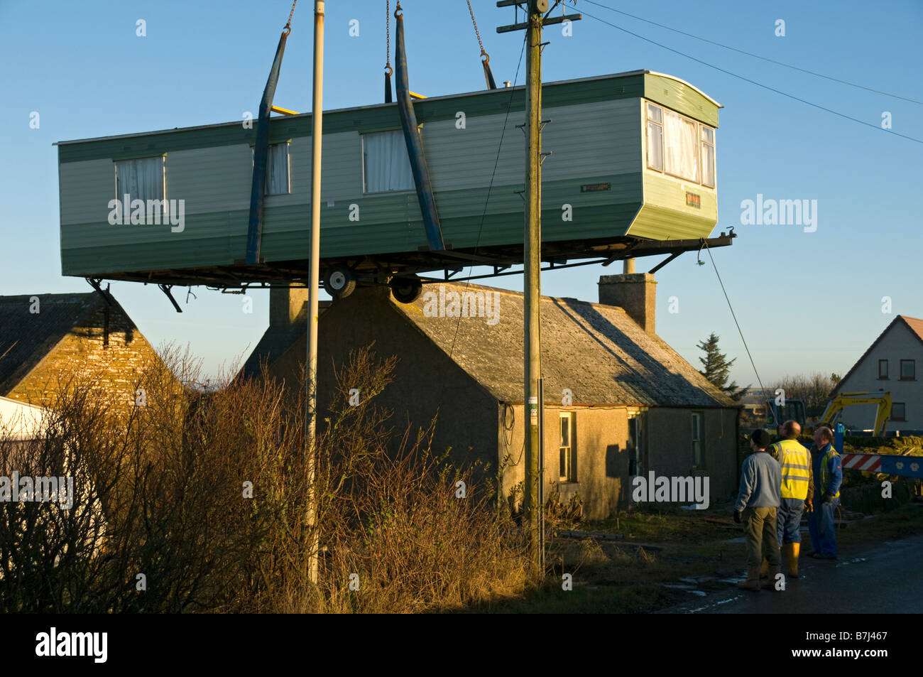 Crane lifting mobile home over hires stock photography and images Alamy