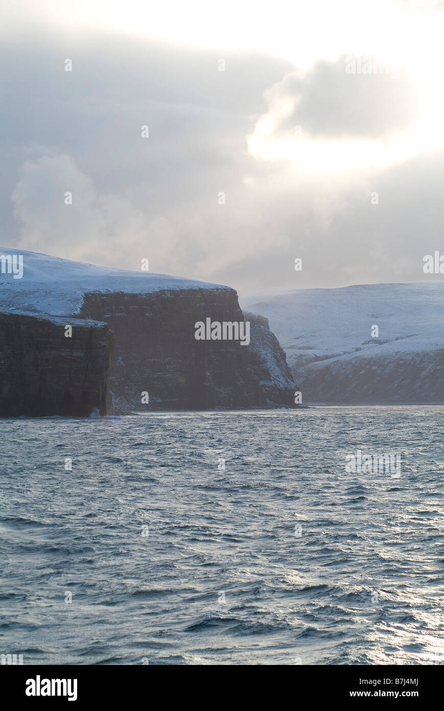 dh Rackwick HOY ORKNEY Grey winter skies snow seacliffs Pentland Firth waters Stock Photo