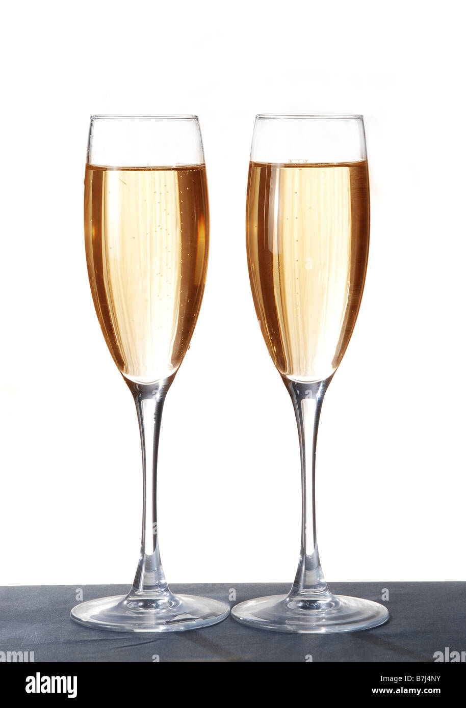Two elegant champagne glasses on a dark surface Stock Photo Alamy