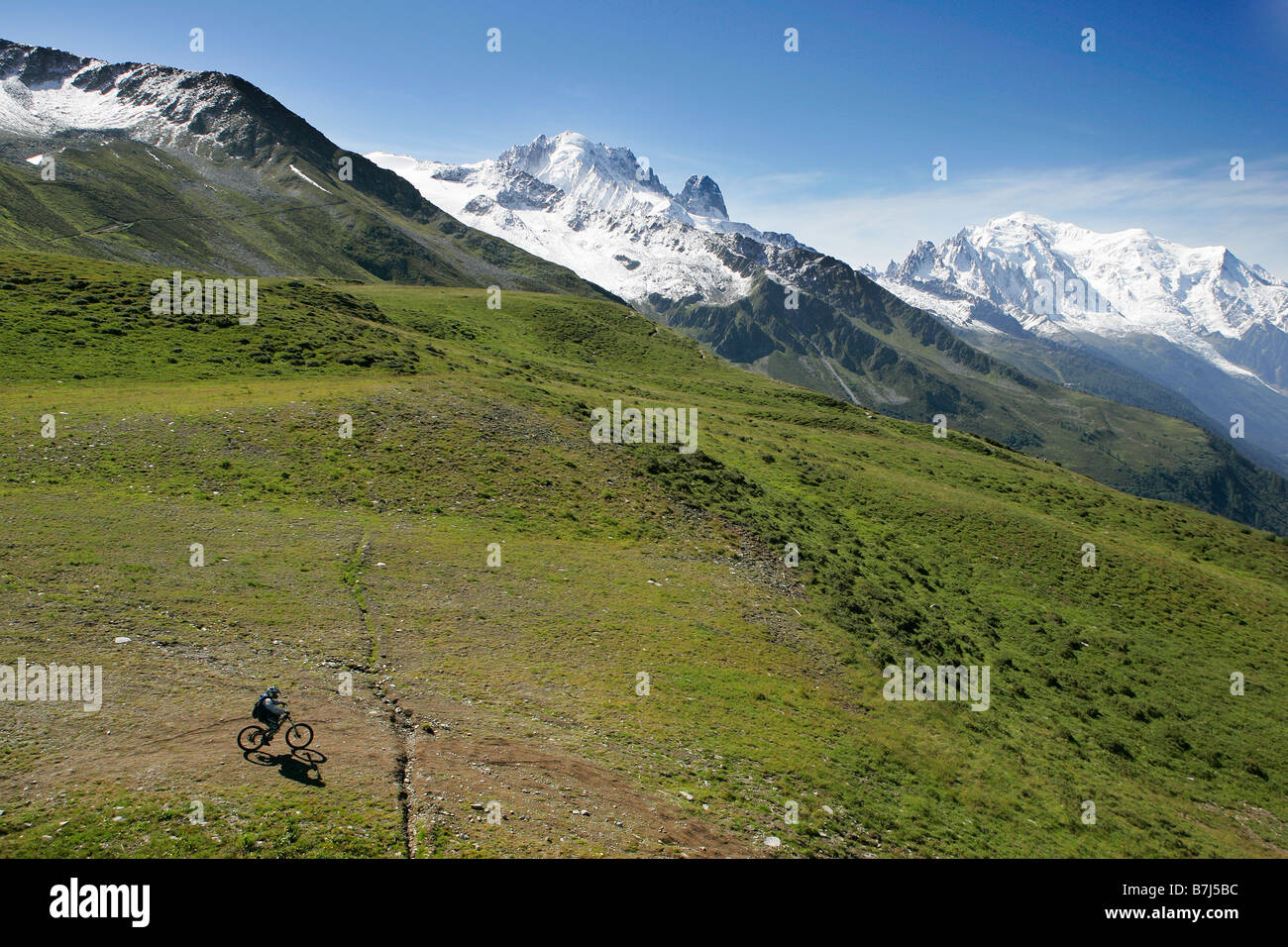 Mountain bike in front of The Mont Blanc, Les Drus and La Verte(left) Stock Photo