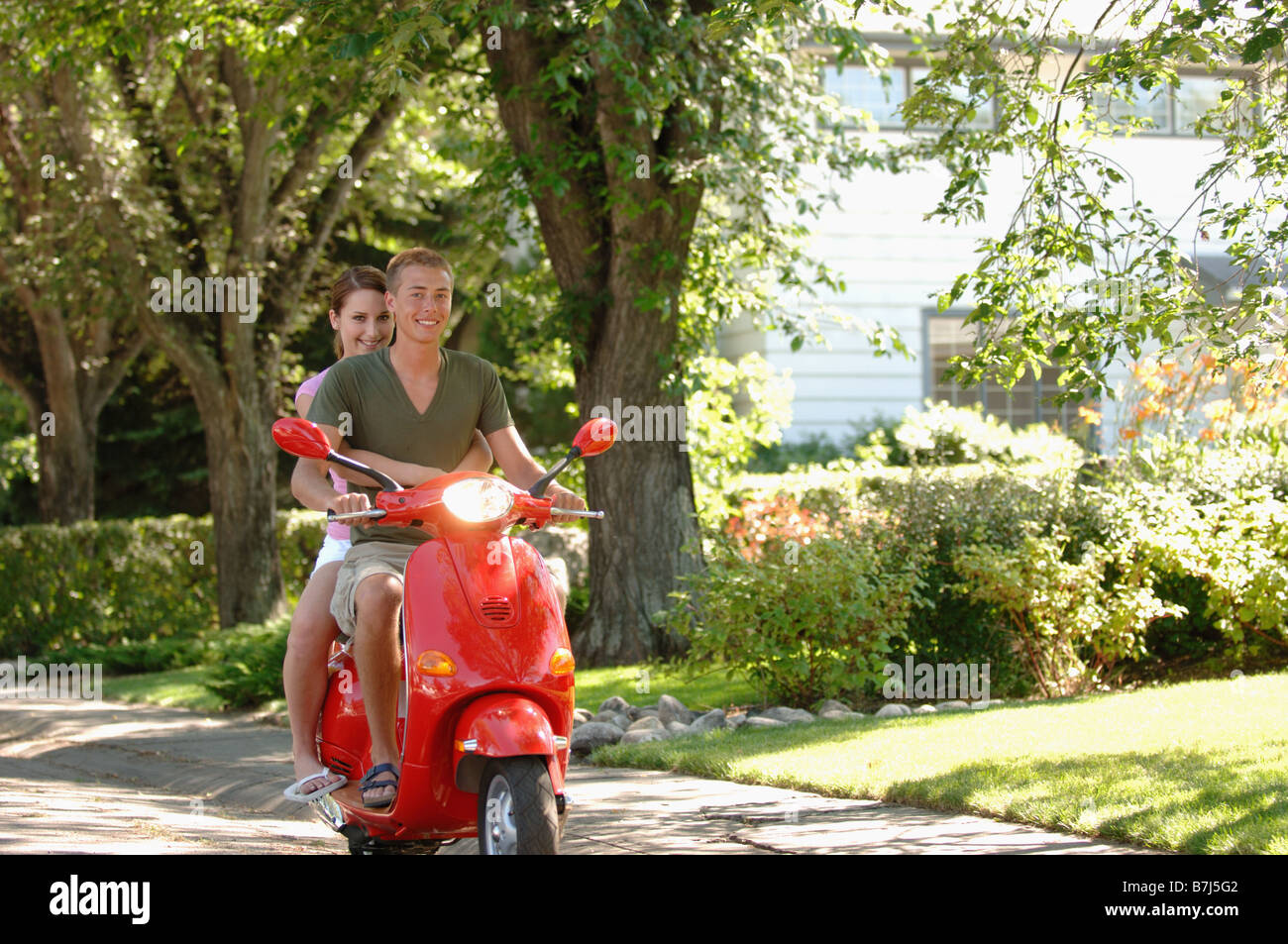 Teenage Boy And Girl Driving Red Vespa Regina Saskatchewan Stock Photo Alamy Teenage Boy And Girl Driving Red Vespa Regina Saskatchewan Stock Photo Alamy