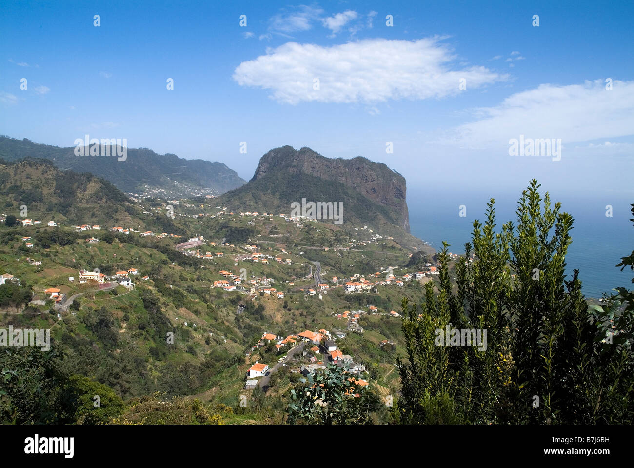 dh Eagle Rock PENHA DE AGUIA MADEIRA Eagle Rock above Porto da Cruz village valley outcrop mountain Stock Photo