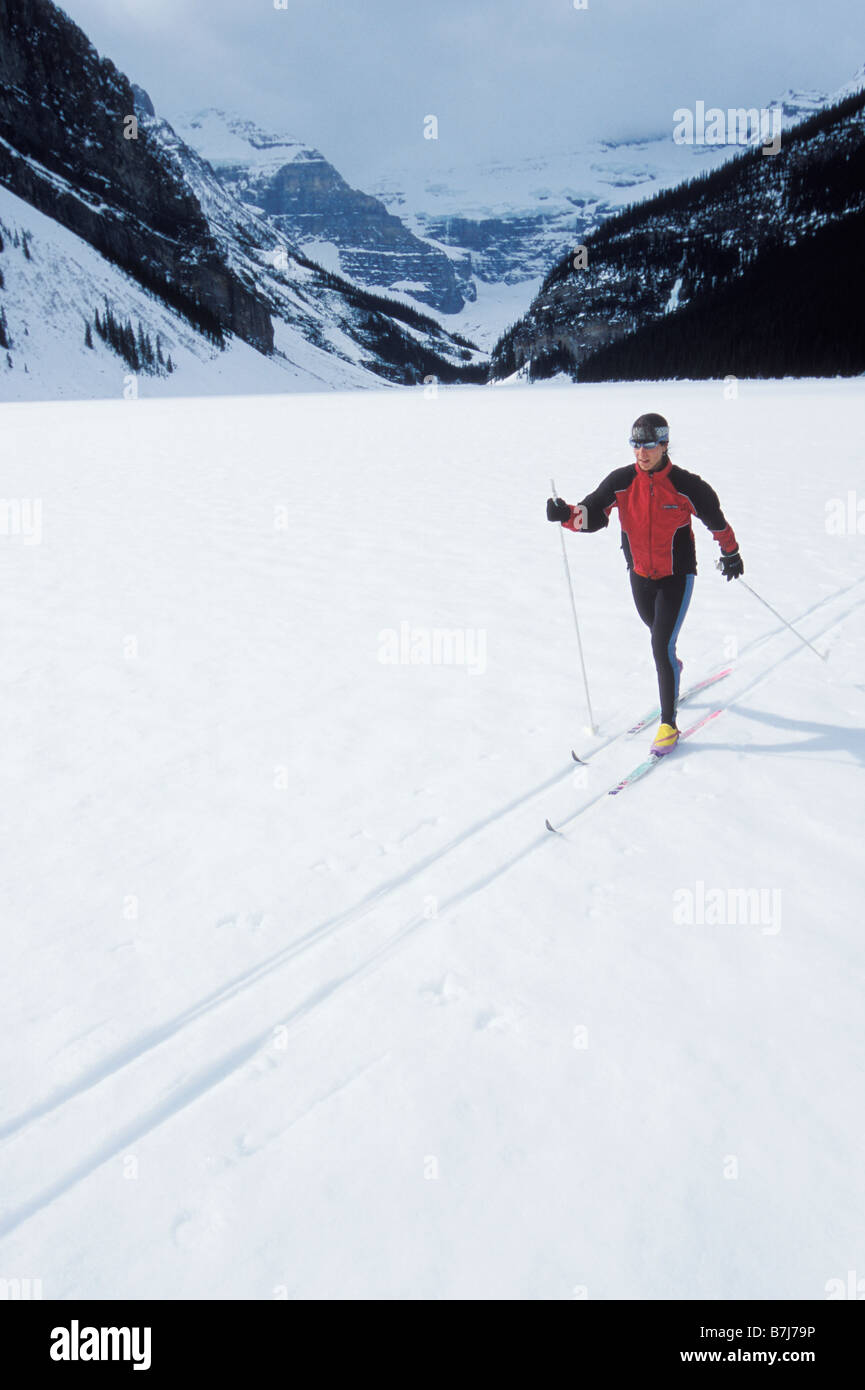Young woman cross country skiing on Lake Louise, Banff National Park