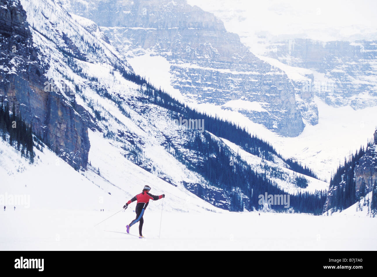Young woman cross country skiing on Lake Louise, Banff National Park