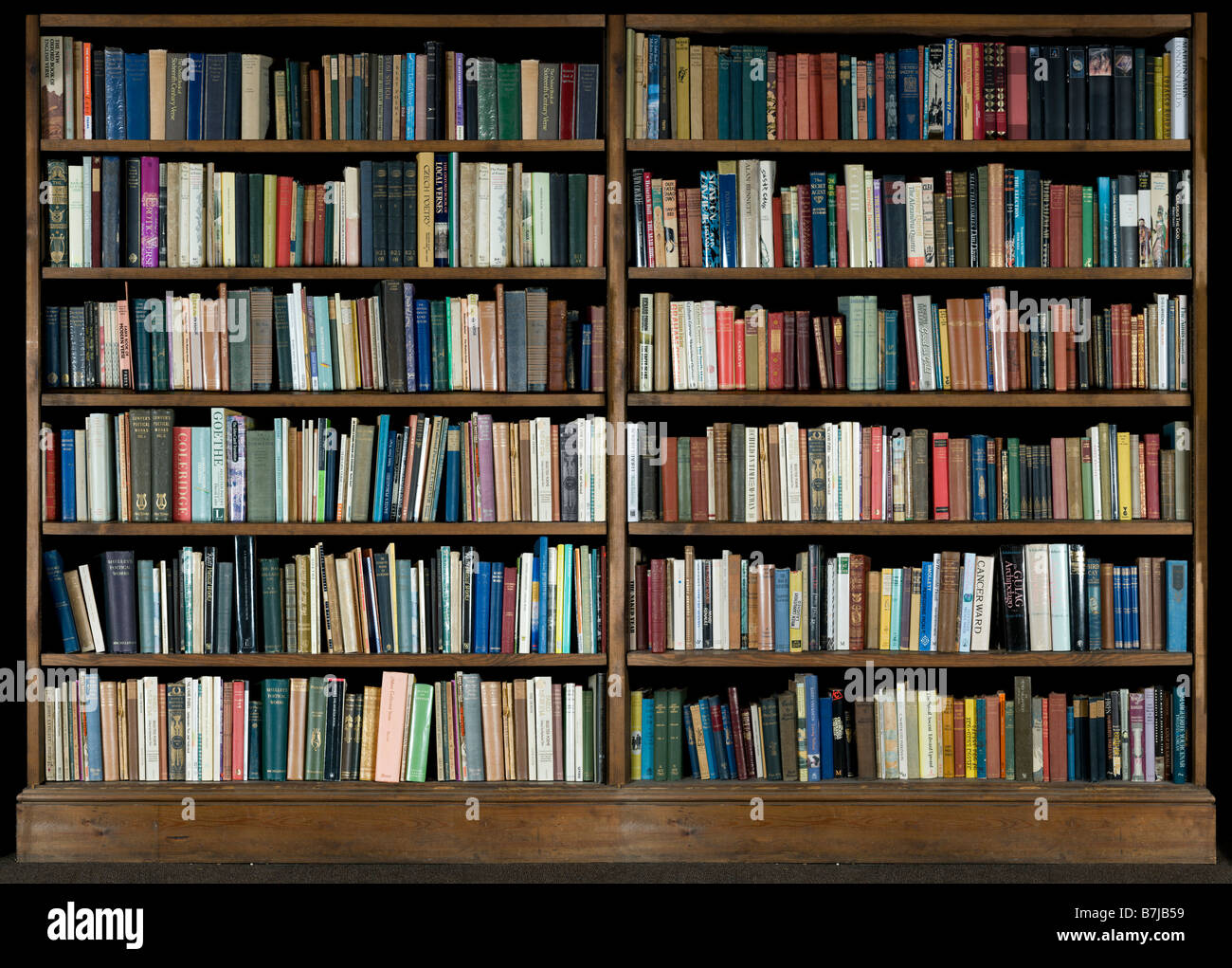 High Resolution Image Of Books On A Bookshelf On A Black Background Stock Photo