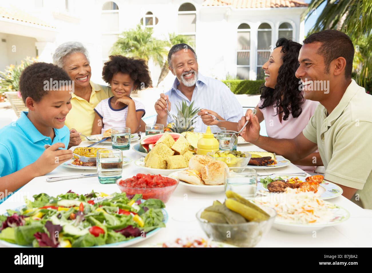 Family Eating An Al Fresco Meal Stock Photo