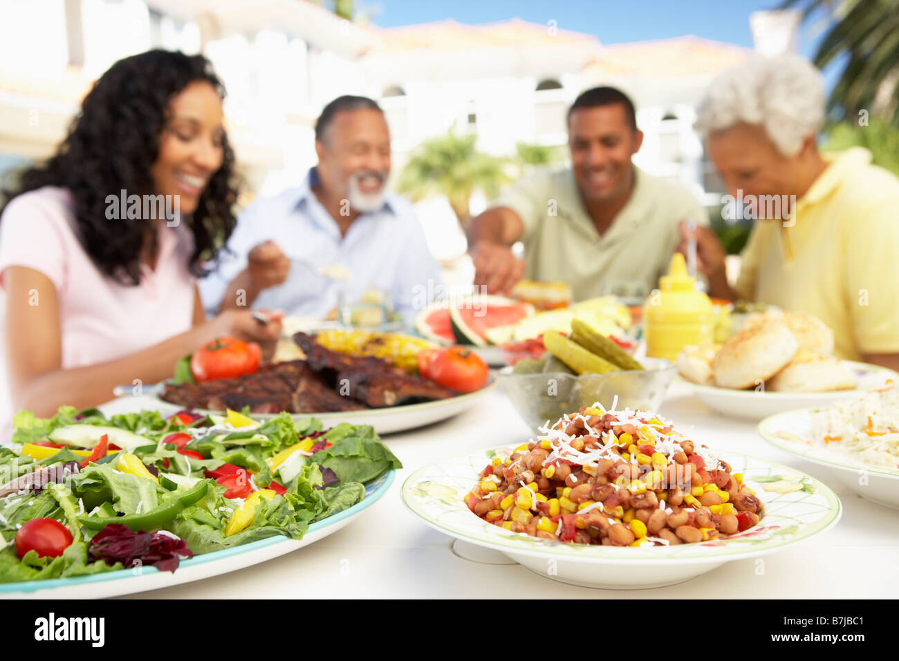 Family Eating An Al Fresco Meal Stock Photo Alamy